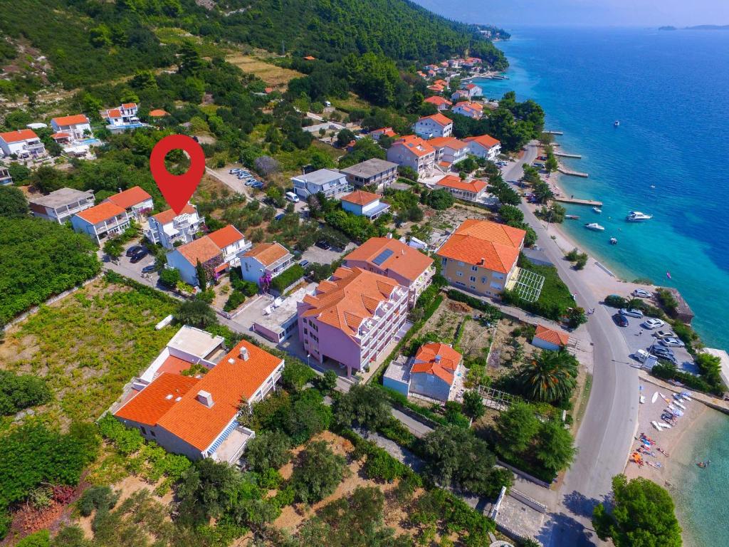 an aerial view of a resort with a red marker at Apartments Jane Perna in Kučište