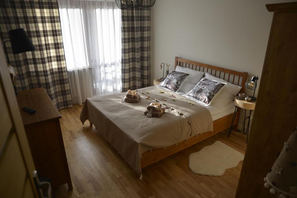 Un ou plusieurs lits dans un hébergement de l'établissement Apartament Kryjówka pod Giewontem