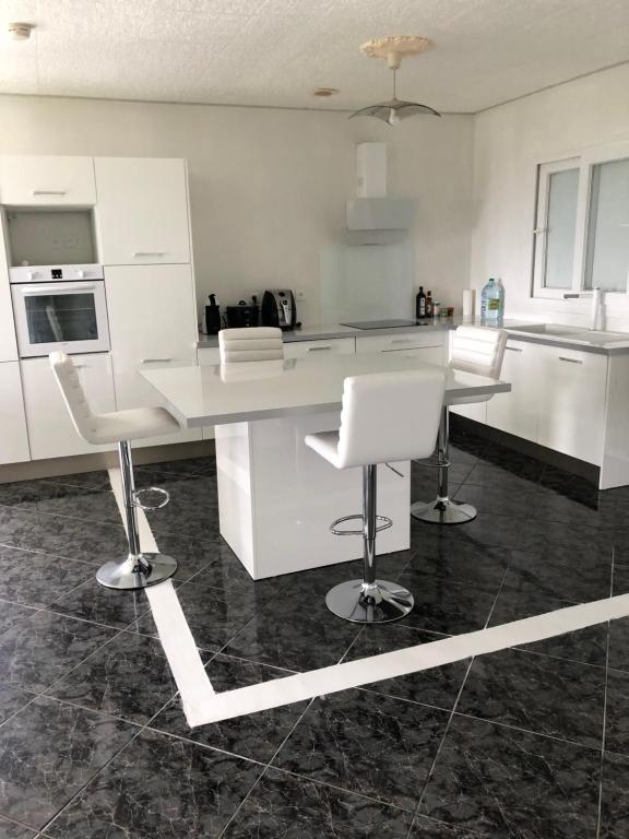 Kuchyň nebo kuchyňský kout v ubytování Cool Home