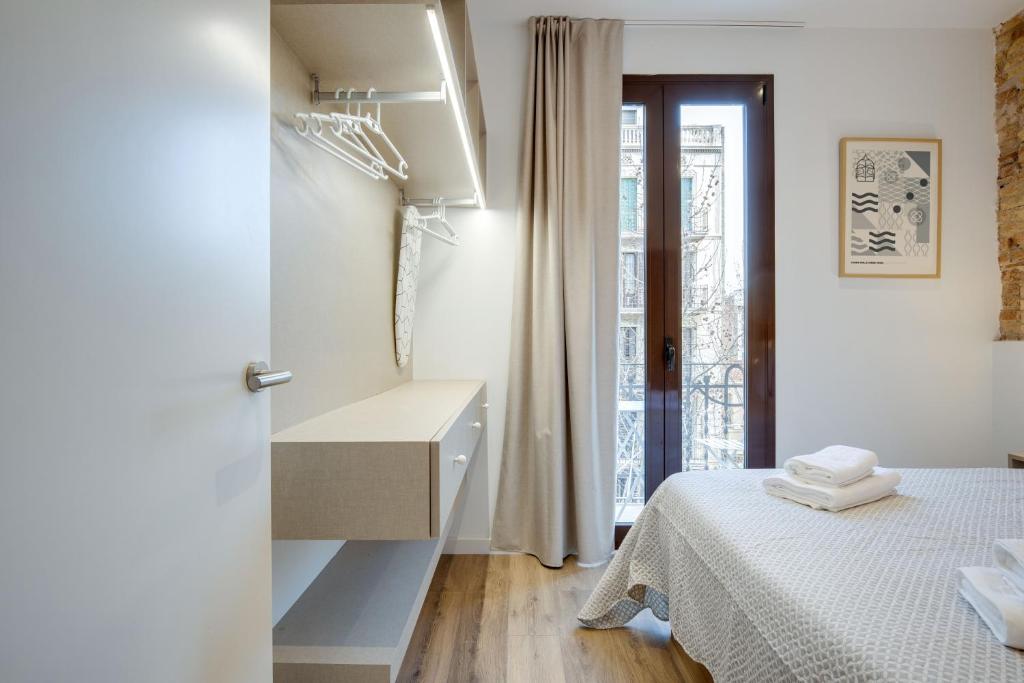 Postel nebo postele na pokoji v ubytování LucasLand Apartments Barcelona