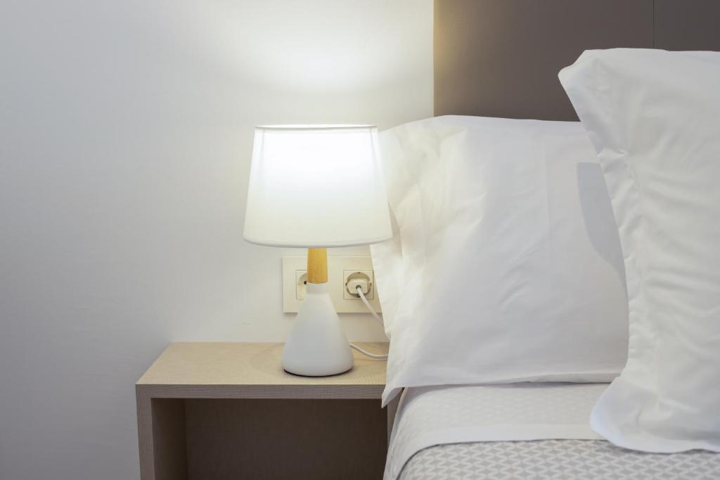 Postel nebo postele na pokoji v ubytování LucasLand Apartments Barcelona