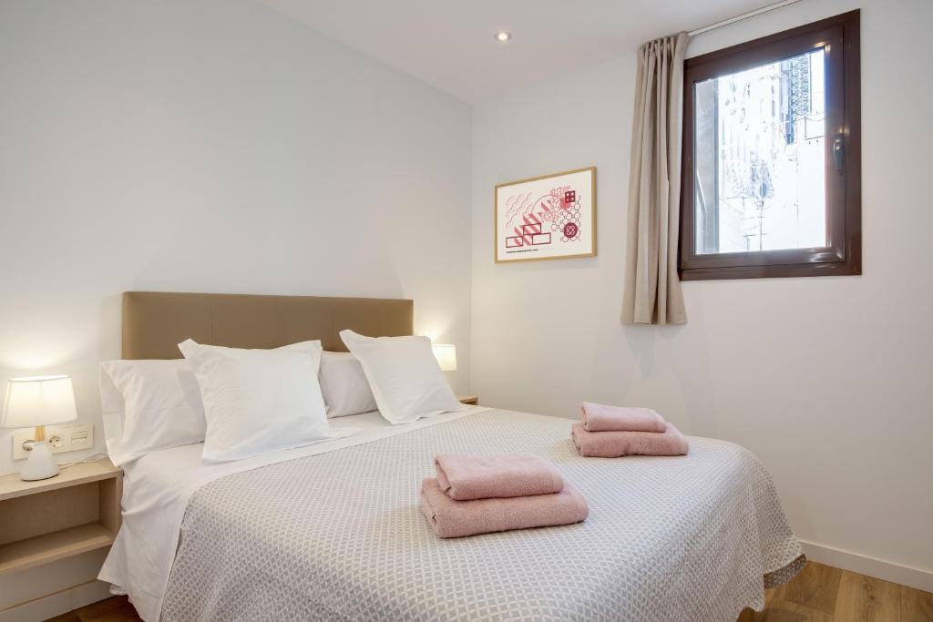 Postel nebo postele na pokoji v ubytování LucasLand Apartments Barcelona