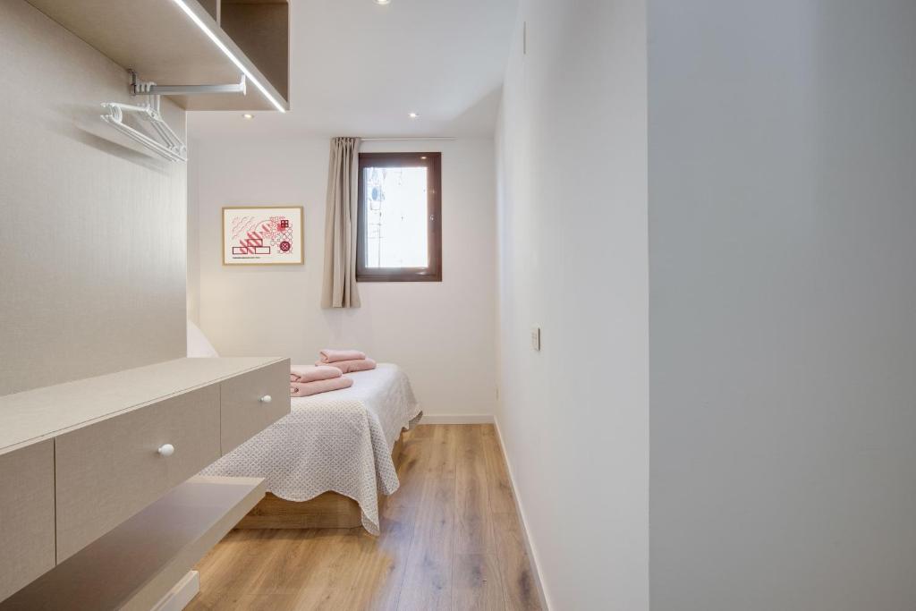 Postel nebo postele na pokoji v ubytování LucasLand Apartments Barcelona
