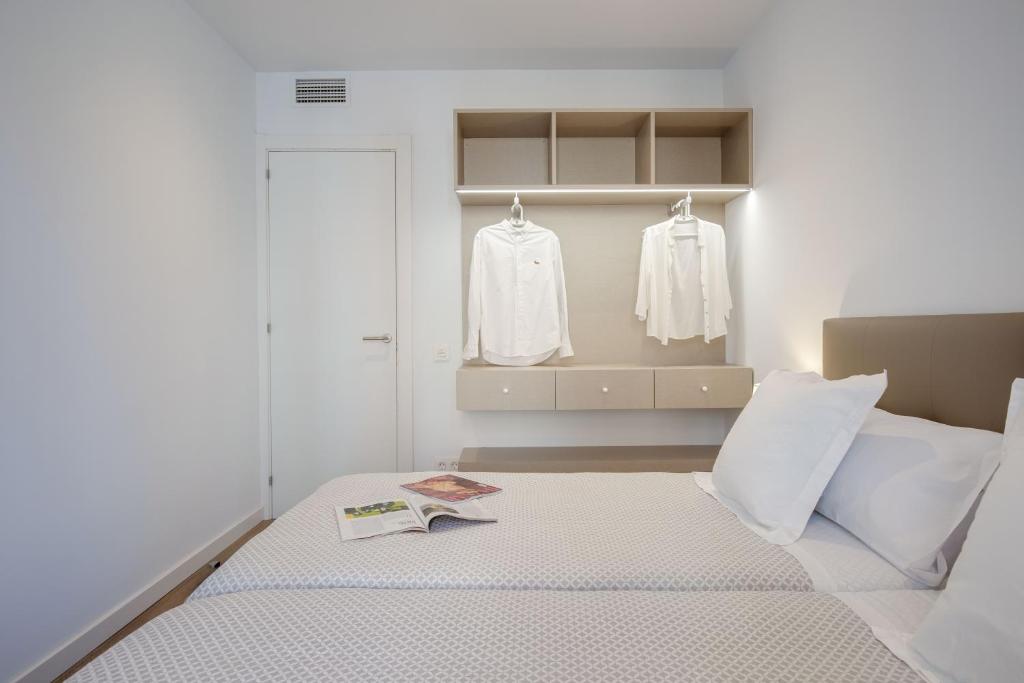 Postel nebo postele na pokoji v ubytování LucasLand Apartments Barcelona