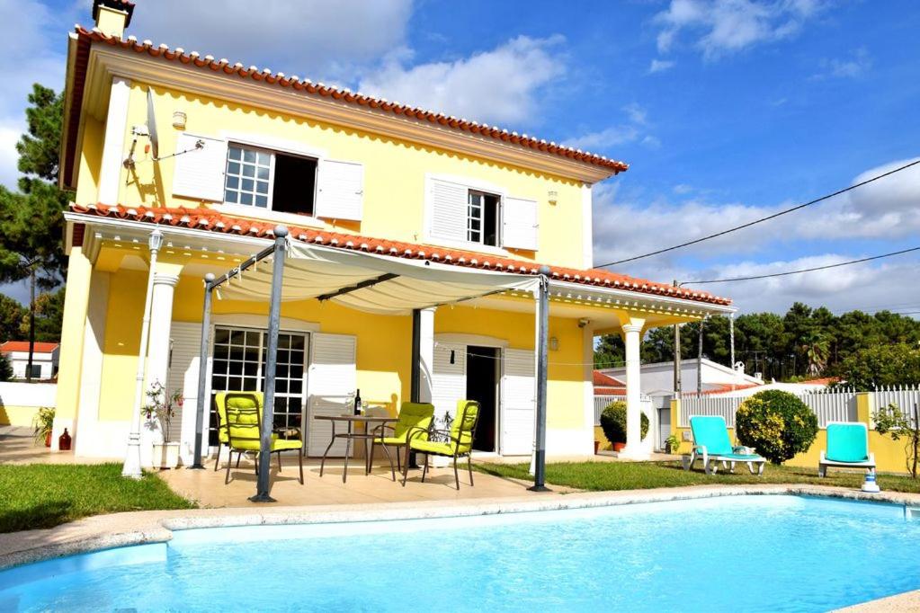 a house with a pool in front of a house at B House Verdizela in Corroios