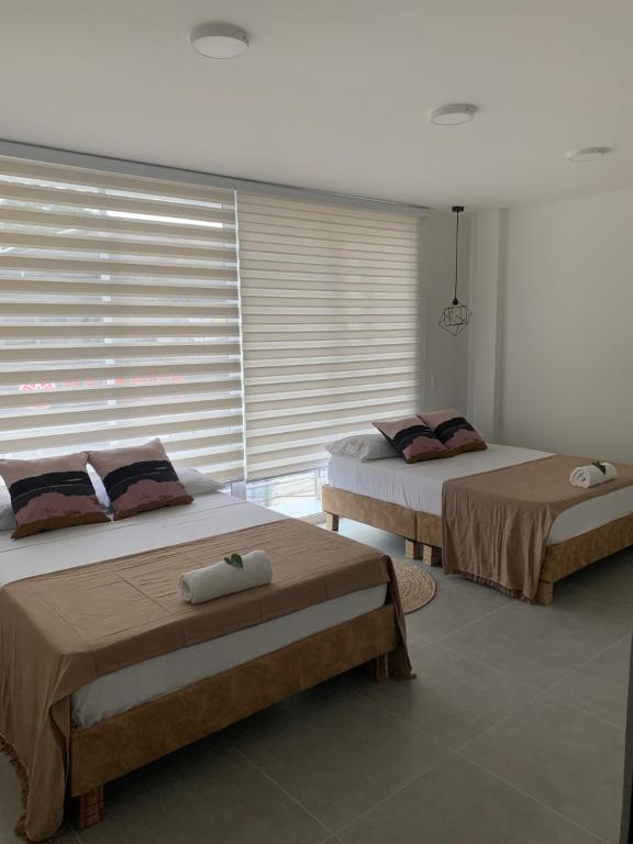 Postel nebo postele na pokoji v ubytování Hotel Viena