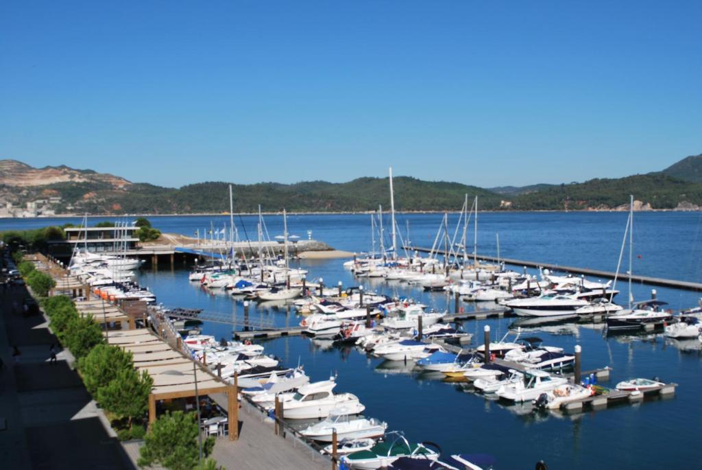 a bunch of boats docked in a harbor at Troia Residence by The Editory - Apartamentos Marina in Troia
