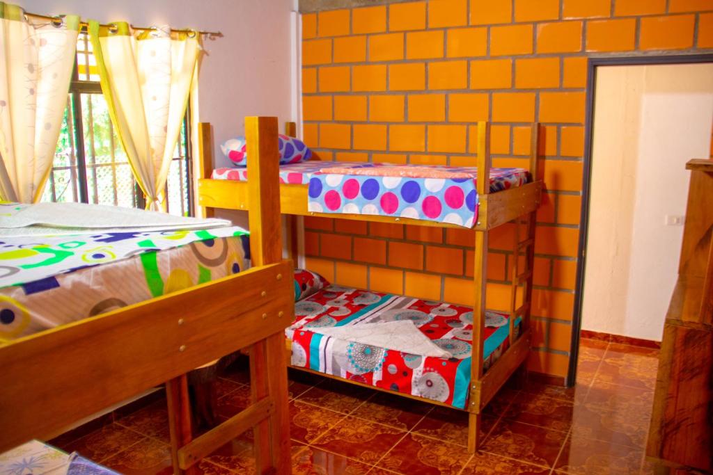 Postel nebo postele na pokoji v ubytování Hostal Luna Llena