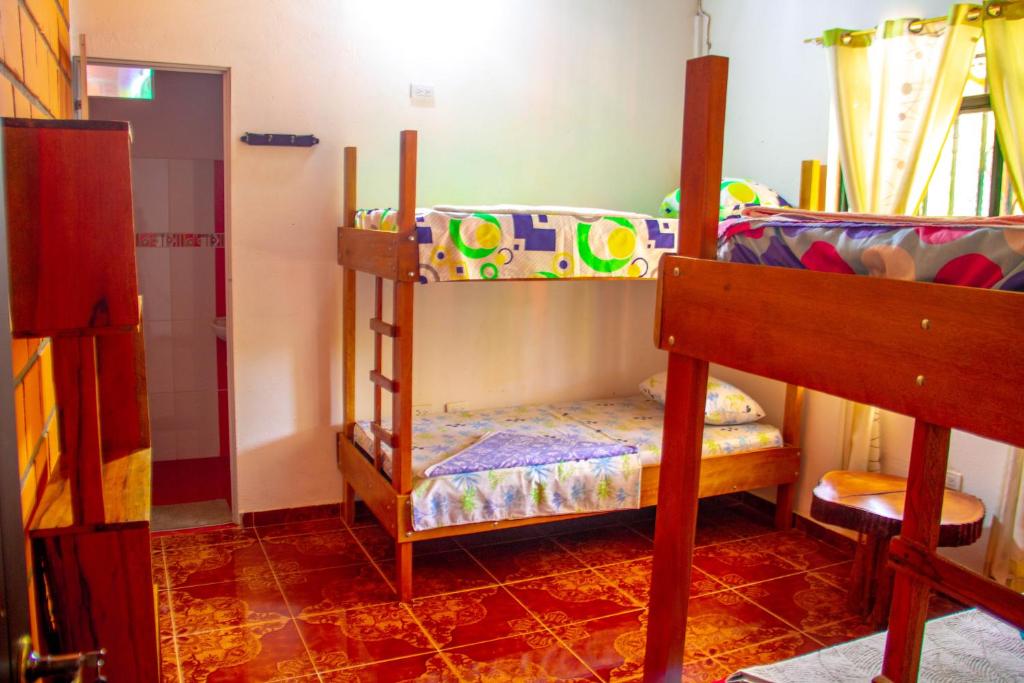 Postel nebo postele na pokoji v ubytování Hostal Luna Llena