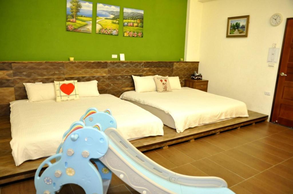 Postel nebo postele na pokoji v ubytování Sky Bird Garden B&B