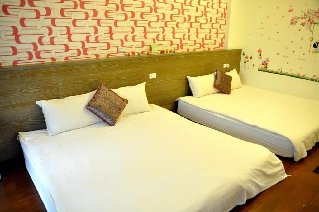 Postel nebo postele na pokoji v ubytování Sky Bird Garden B&B