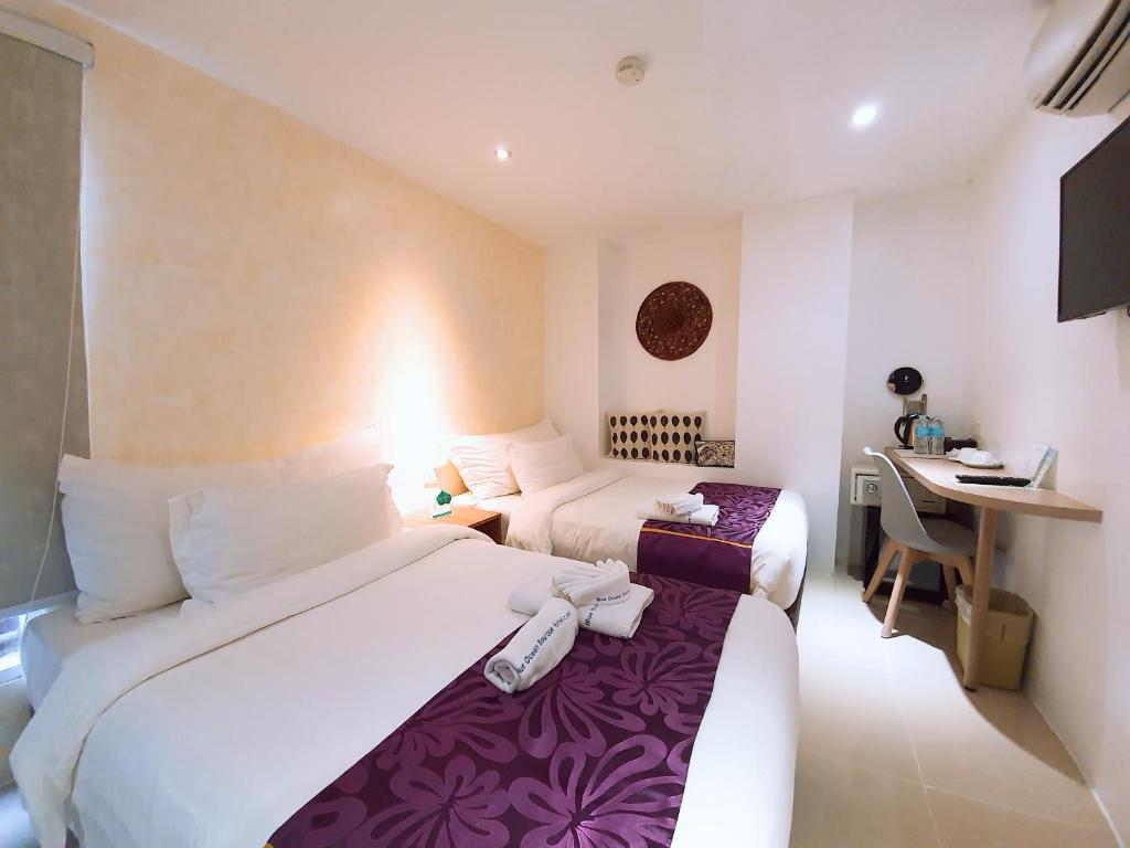 En eller flere senge i et værelse på BLUE OCEAN BOUTIQUE HOTEL - Boracay Island