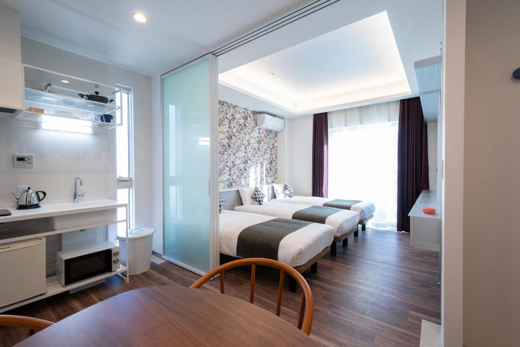 Postel nebo postele na pokoji v ubytování Hotel SAILS Asakusa
