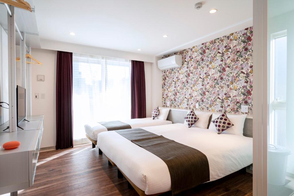 Postel nebo postele na pokoji v ubytování Hotel SAILS Asakusa