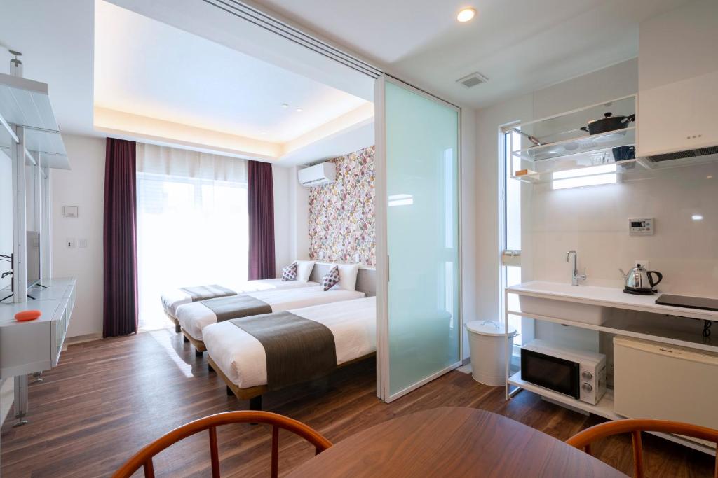 Postel nebo postele na pokoji v ubytování Hotel SAILS Asakusa