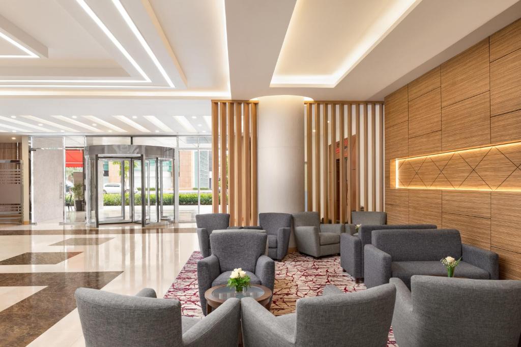 a lobby with chairs and a waiting room at Ramada by Wyndham Dubai Deira in Dubai