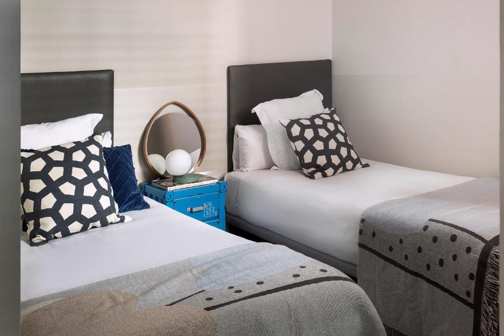 Postel nebo postele na pokoji v ubytování C211 Barcelona Apartments