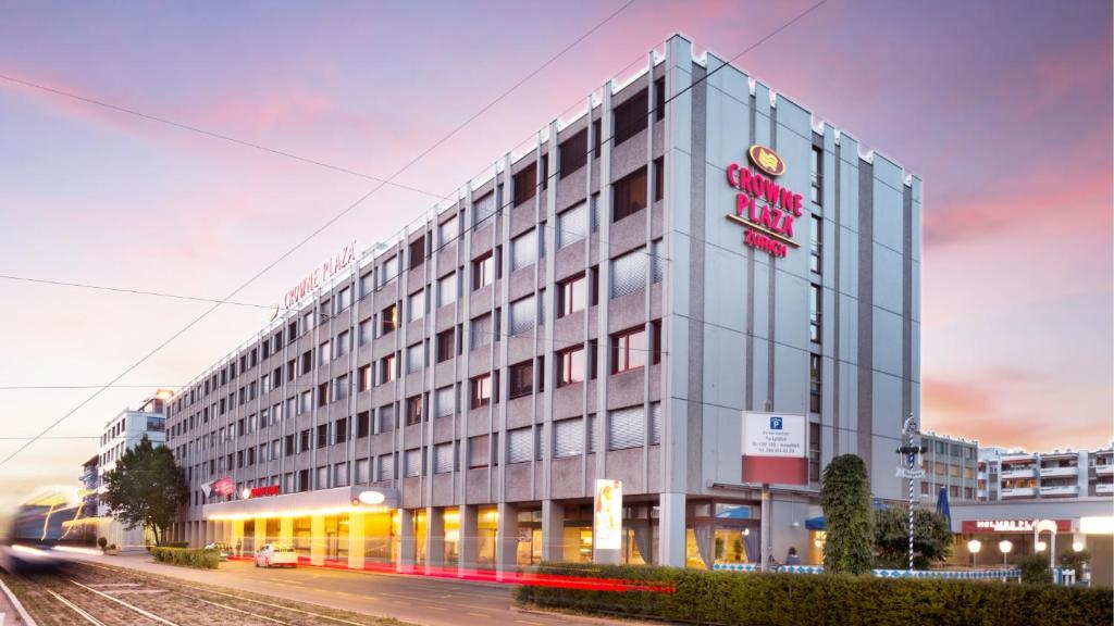 a building with a sign on the side of it at Crowne Plaza Zürich, an IHG Hotel in Zurich