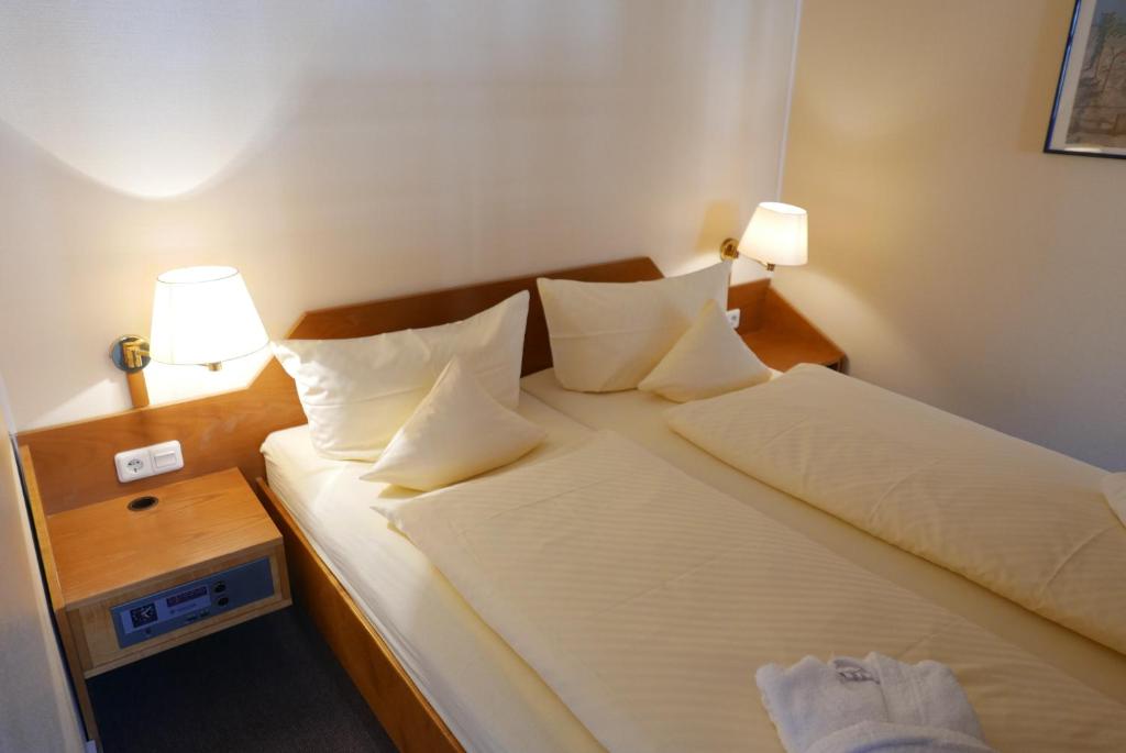 Ένα ή περισσότερα κρεβάτια σε δωμάτιο στο Inselresidenz Strandburg Ferienwoh