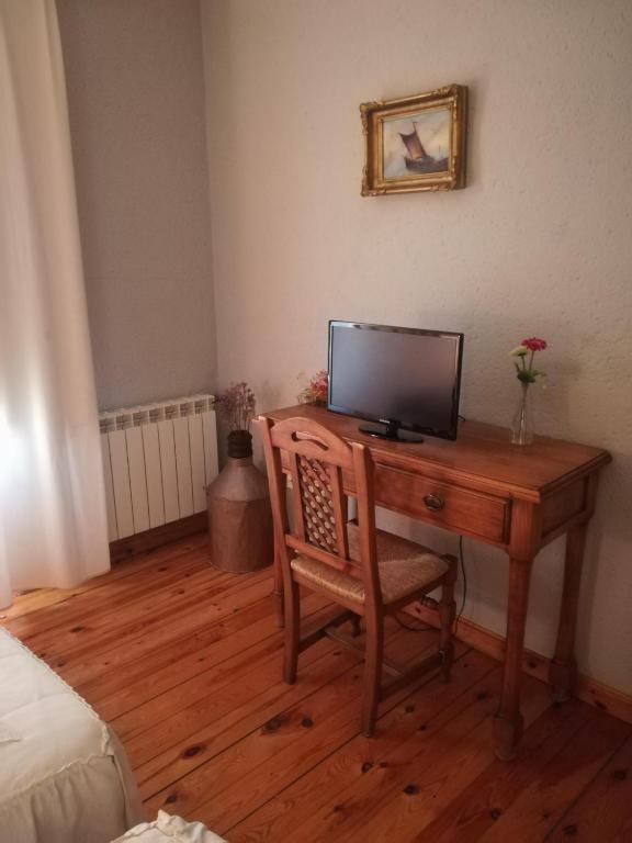 TV a/nebo společenská místnost v ubytování La Cerca