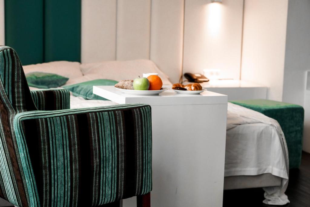 Postel nebo postele na pokoji v ubytování Hotel Ecu