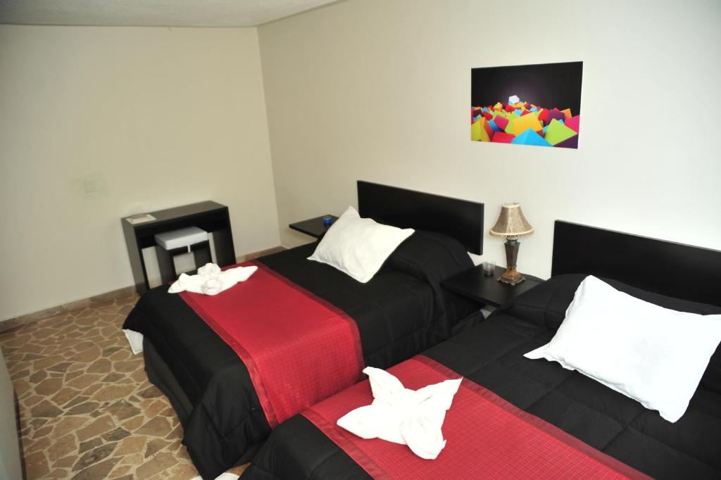 Postel nebo postele na pokoji v ubytování G y V Hotels