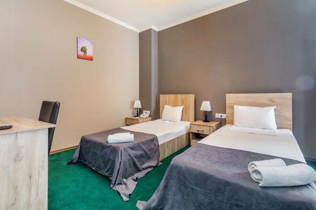 Postel nebo postele na pokoji v ubytování Hotel Marlyn