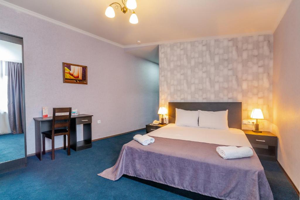 Postel nebo postele na pokoji v ubytování Hotel Marlyn