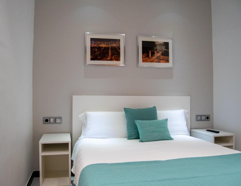 Postel nebo postele na pokoji v ubytování Hostal Apolo