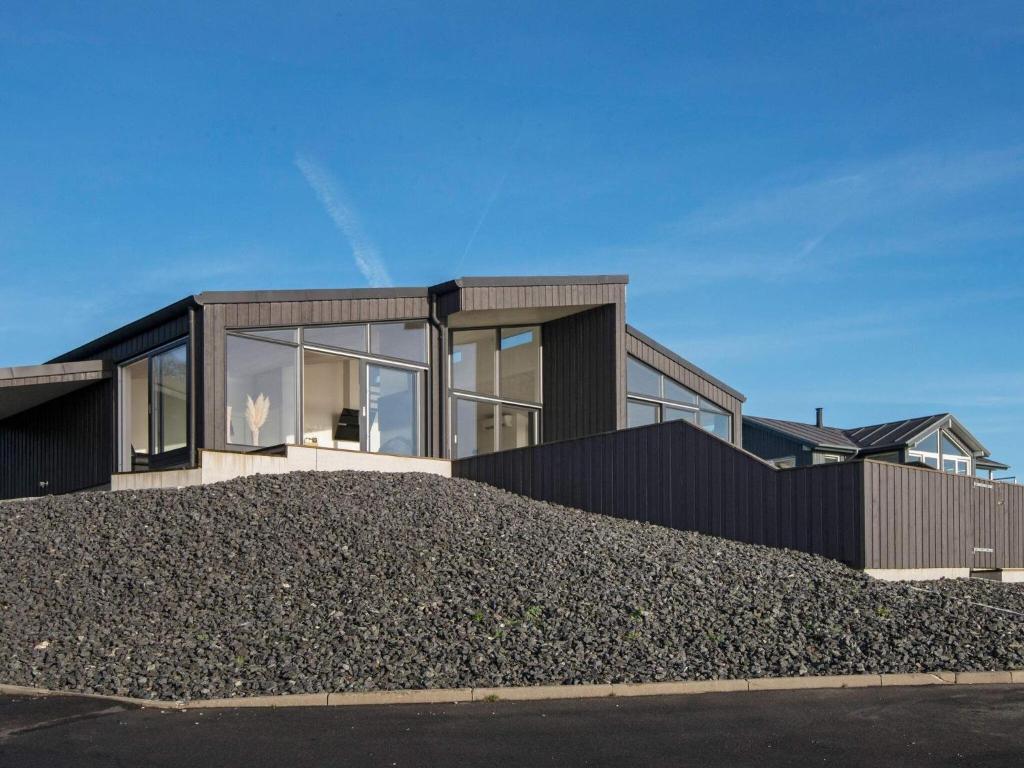 a house on top of a pile of gravel at 6 person holiday home in Aabenraa in Aabenraa