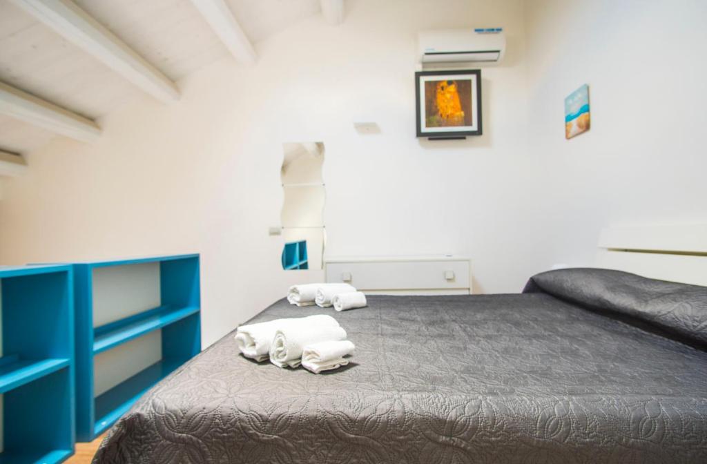 Łóżko lub łóżka w pokoju w obiekcie Casa Gelsomino