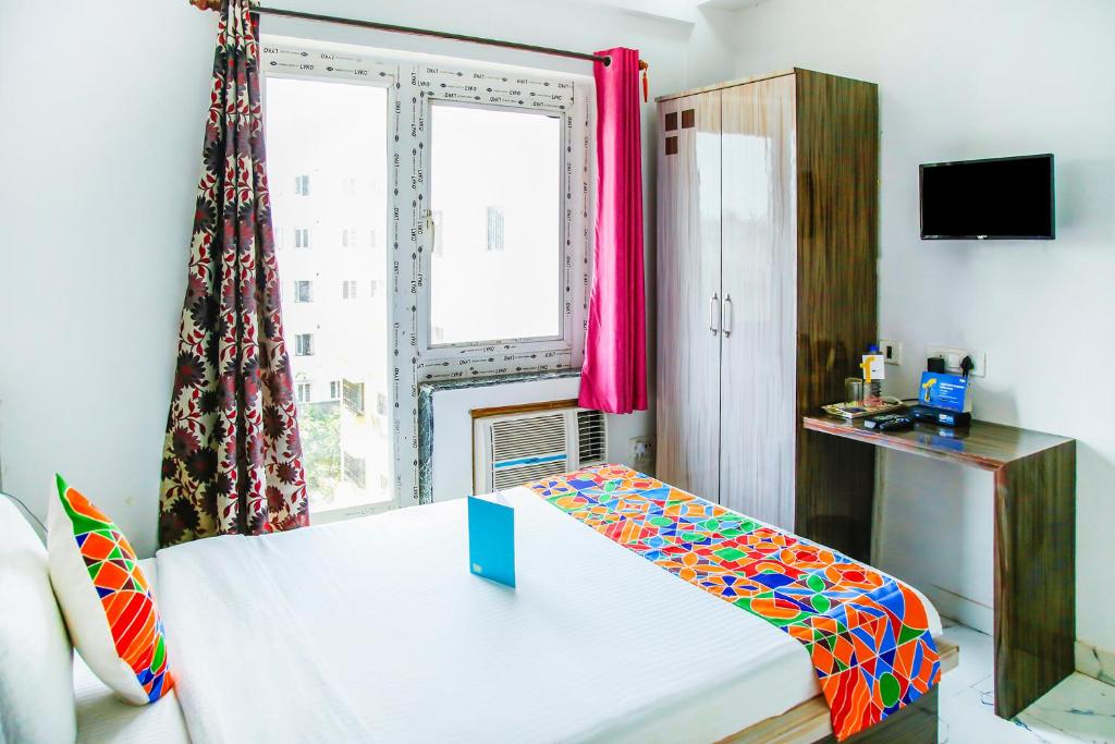 Postel nebo postele na pokoji v ubytování FabHotel Eleanora - New Town
