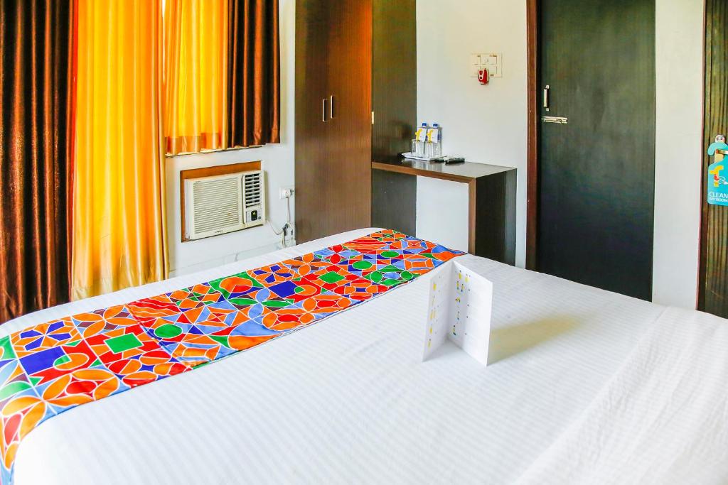 Postel nebo postele na pokoji v ubytování FabHotel Eleanora - New Town