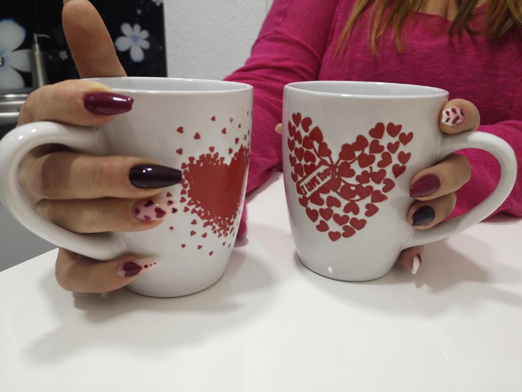 Příslušenství pro přípravu čaje a kávy v ubytování Sweet Dreams Apartment