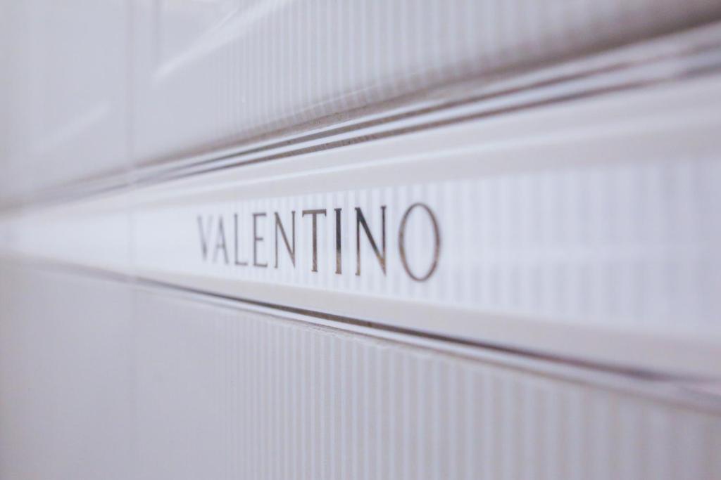 a close up of the side of a white car with the word martinino at White & Gray Apartments in Prague