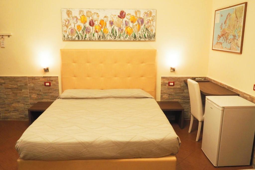 Łóżko lub łóżka w pokoju w obiekcie Hotel Ester