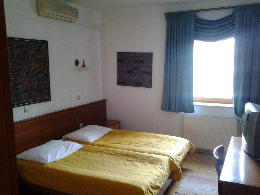 Postel nebo postele na pokoji v ubytování Guest House Arvaj