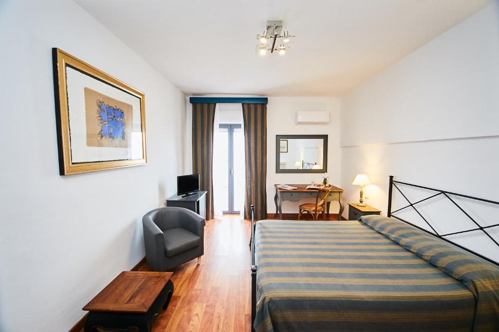 Postel nebo postele na pokoji v ubytování Hotel Enterprise