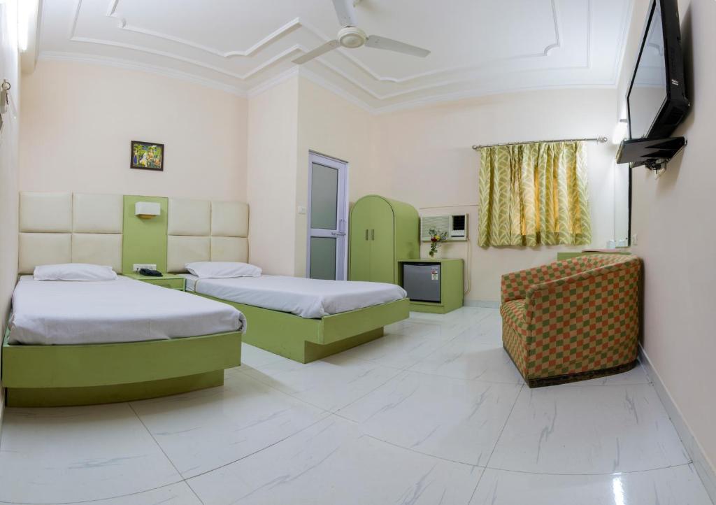Postel nebo postele na pokoji v ubytování Hotel Kwality