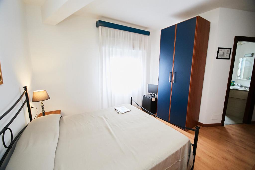 Postel nebo postele na pokoji v ubytování Hotel Enterprise