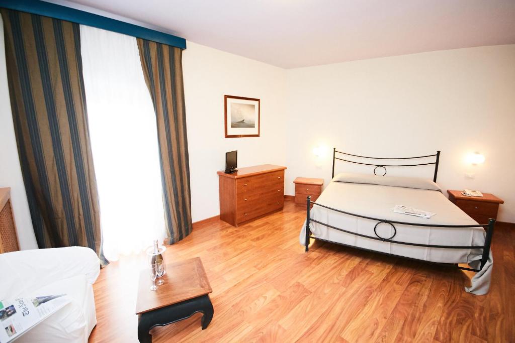 Postel nebo postele na pokoji v ubytování Hotel Enterprise