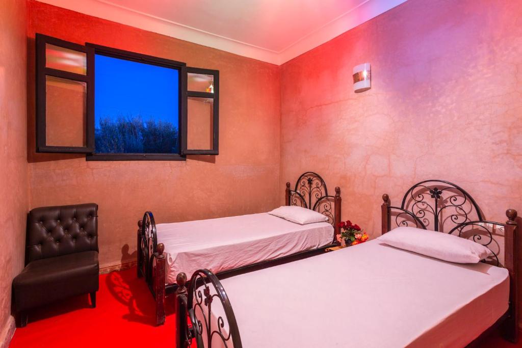 Postel nebo postele na pokoji v ubytování Riad Oussari