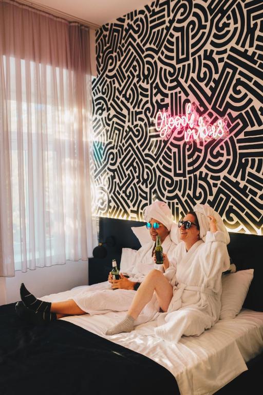 Postel nebo postele na pokoji v ubytování Hotel Marienplatz Podgorica