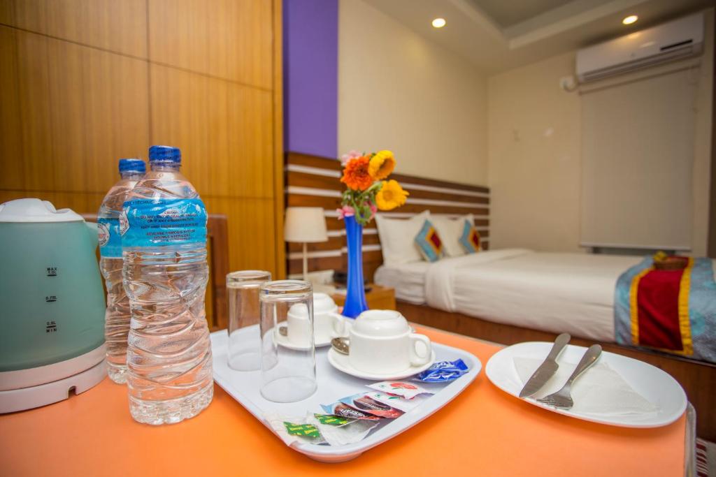 Postel nebo postele na pokoji v ubytování Asian Boutique Hotel
