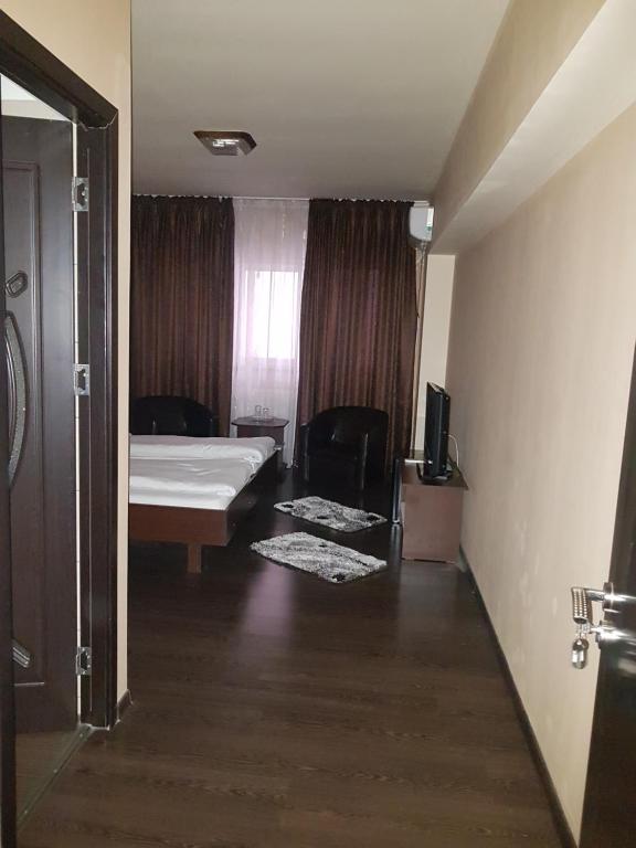 Postel nebo postele na pokoji v ubytování Vila Crinul
