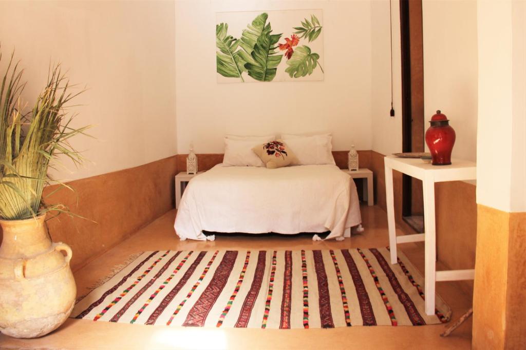 Postel nebo postele na pokoji v ubytování Riad El Ouarda