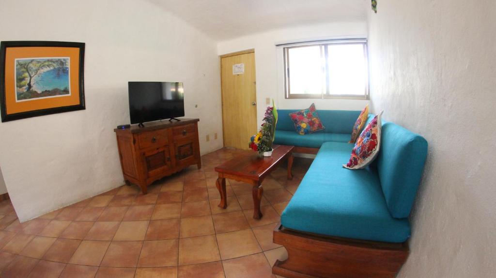TV a/nebo společenská místnost v ubytování Hotel Casa Iguana Mismaloya