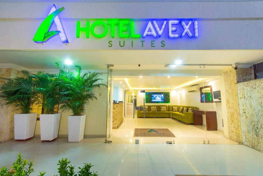 a hotel ayx suites sign in a lobby at Hotel Avexi Suites By GEH Suites in Cartagena de Indias