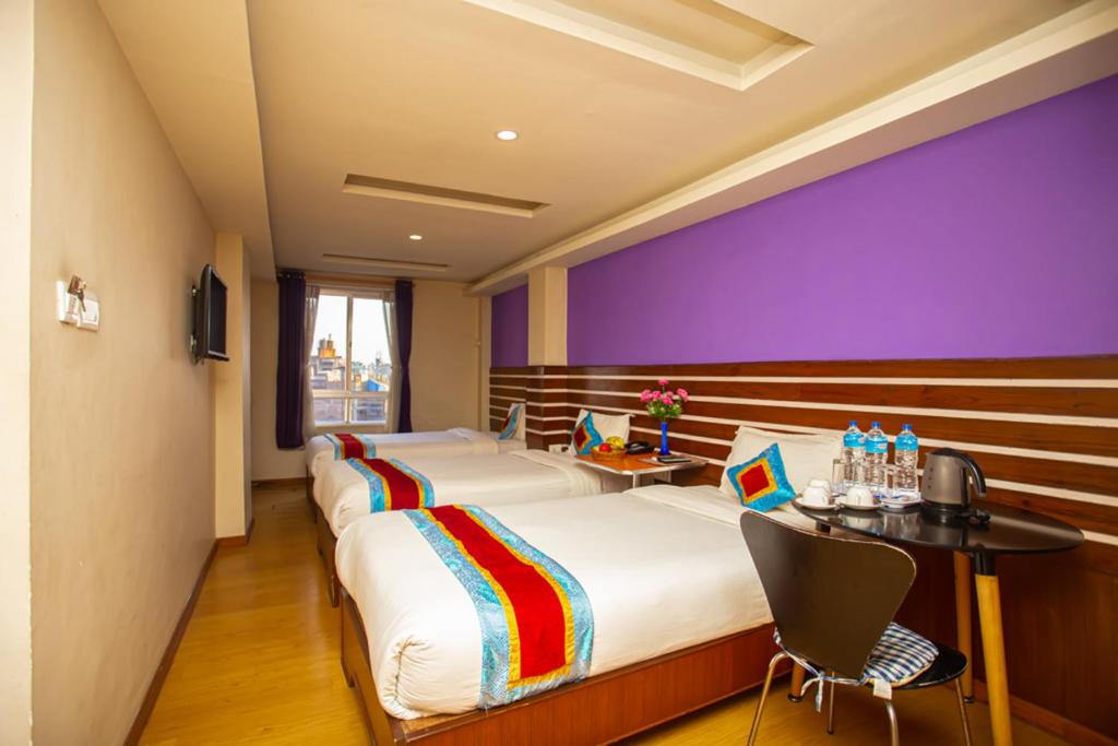 Postel nebo postele na pokoji v ubytování Asian Boutique Hotel