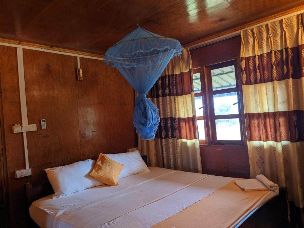 Postel nebo postele na pokoji v ubytování Sunntop Cabana